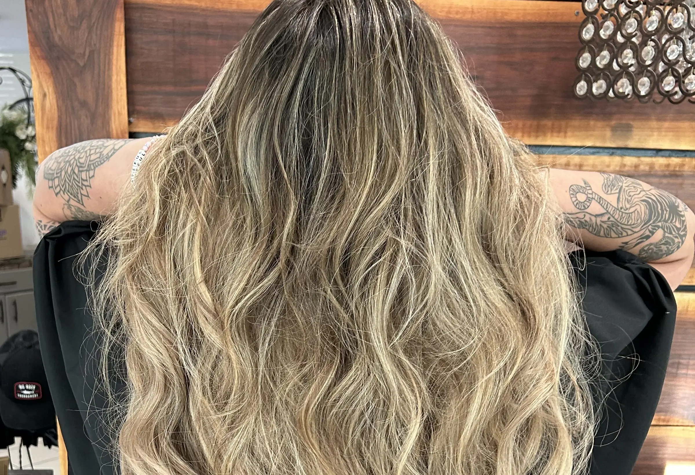 Long hand-painted balayage falling in soft waves