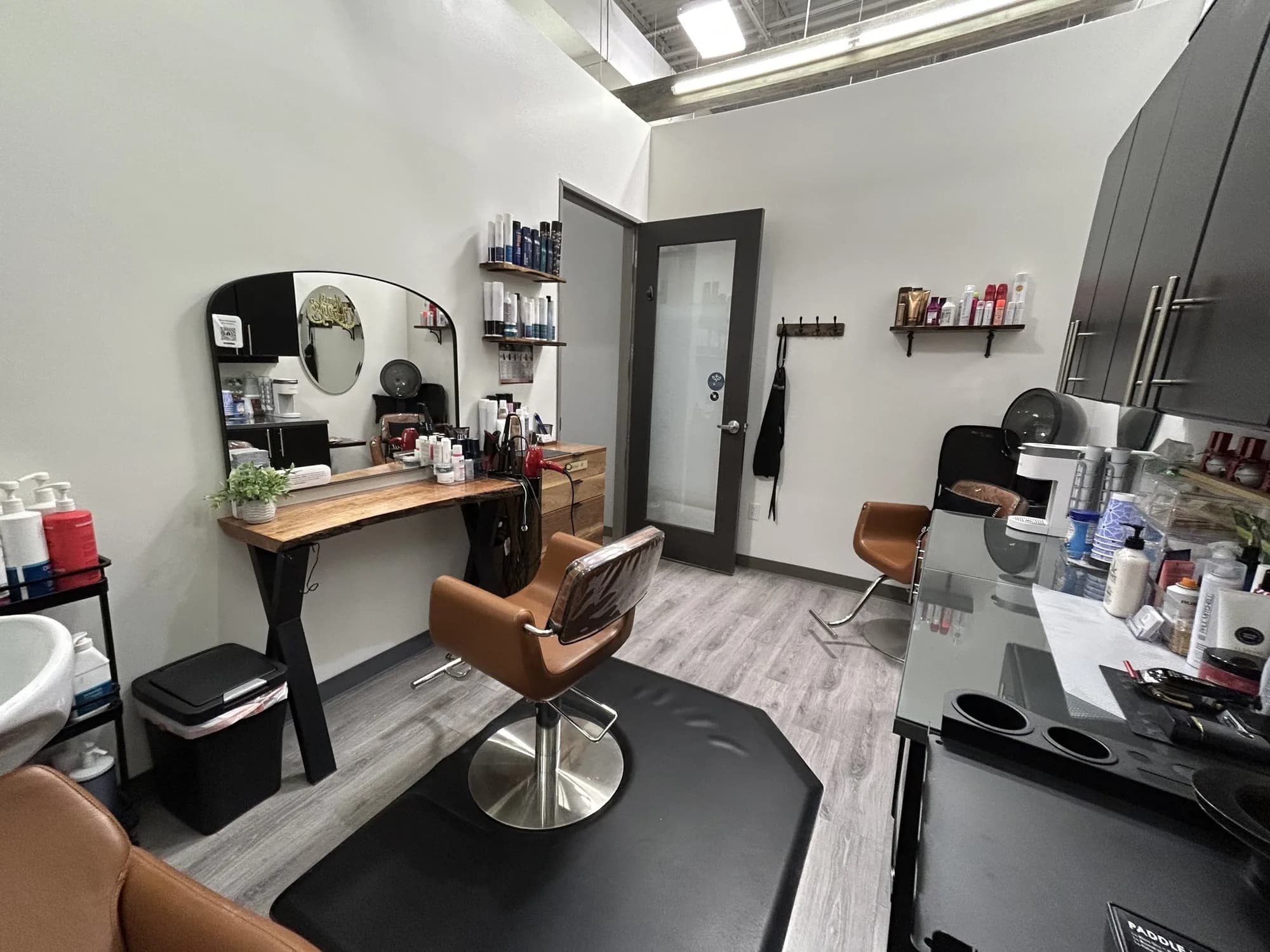 Inside Maria's studio at Salon Lofts — styling chair, wash basin and workstation